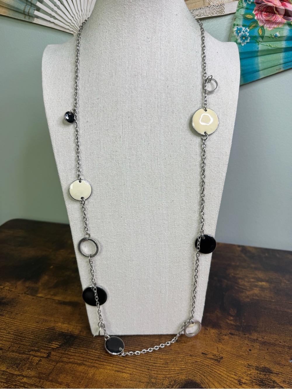 Silver Tone Long Disc Pendant Necklace with Black and Cream Enamel Accents
